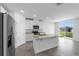 Modern kitchen boasting stainless steel appliances and granite countertops at 1340 Oak Valley Drive, Auburndale, FL 33823