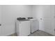 Laundry room with a modern washer and dryer, and tile flooring at 1340 Oak Valley Drive, Auburndale, FL 33823