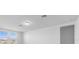 Bright, white living room featuring recessed lighting and sun-drenched windows at 1340 Oak Valley Drive, Auburndale, FL 33823