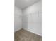 Walk-in closet with carpet and metal shelving for optimal storage at 1340 Oak Valley Drive, Auburndale, FL 33823