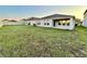 A full yard view of a home with a covered patio at 1397 Axel Cir, Winter Haven, FL 33880