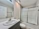 Bathroom with a combination shower and bathtub and a white vanity at 1397 Axel Cir, Winter Haven, FL 33880