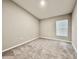 Neutral bedroom featuring carpet and one window with blinds at 1397 Axel Cir, Winter Haven, FL 33880