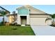 Charming single-Gathering home with a well-manicured lawn and a two-car garage at 1397 Axel Cir, Winter Haven, FL 33880
