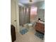 A standard bathroom with a shower, sink, and commode at 1411 Grand Cayman Cir, Winter Haven, FL 33884