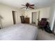 Comfortable bedroom featuring neutral walls, cozy carpeting, and lots of natural light at 1411 Grand Cayman Cir, Winter Haven, FL 33884