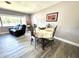 Elegant dining room adjacent to the living area with stylish table setting at 1442 Gilmore Ave, Lakeland, FL 33805