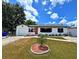 Charming single story home with a well maintained lawn and landscaping at 1442 Gilmore Ave, Lakeland, FL 33805
