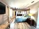 Spacious main bedroom with a decorative bed frame and modern decor at 1442 Gilmore Ave, Lakeland, FL 33805