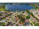 Aerial view showing the home's location within a mature and established residential neighborhood near a lake at 1447 Kingfish Ln, Winter Haven, FL 33884