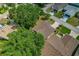 Drone photo highlighting the home's manicured lawn and mature trees, creating a private oasis at 1447 Kingfish Ln, Winter Haven, FL 33884