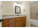 Bathroom showcasing a vanity with granite countertop and tile flooring at 1447 Kingfish Ln, Winter Haven, FL 33884