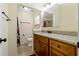 Stylish bathroom with granite countertop vanity and tiled shower at 1447 Kingfish Ln, Winter Haven, FL 33884