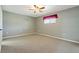 Neutral bedroom featuring a ceiling fan and a window at 1447 Kingfish Ln, Winter Haven, FL 33884