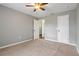 Bright bedroom with carpeted floors and a ceiling fan at 1447 Kingfish Ln, Winter Haven, FL 33884