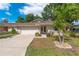 Charming single-story home with a two-car garage, well-manicured lawn, and inviting curb appeal at 1447 Kingfish Ln, Winter Haven, FL 33884