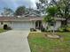 Charming single-story home with a well-manicured lawn and inviting curb appeal at 1447 Kingfish Ln, Winter Haven, FL 33884