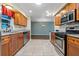 A well-equipped kitchen with stainless steel appliances, granite counters, and tile flooring at 1447 Kingfish Ln, Winter Haven, FL 33884