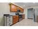 Well-lit kitchen boasts stainless steel appliances, granite countertops, and ample cabinet space at 1447 Kingfish Ln, Winter Haven, FL 33884