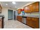 Bright kitchen featuring stainless steel appliances, granite countertops, and tile flooring at 1447 Kingfish Ln, Winter Haven, FL 33884