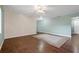 Expansive living room with hardwood floors, a ceiling fan, and ample space for a variety of furniture arrangements at 1447 Kingfish Ln, Winter Haven, FL 33884
