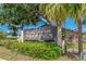 Lake Dexter Moorings neighborhood sign framed by lush landscaping and a bright blue sky at 1447 Kingfish Ln, Winter Haven, FL 33884