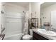 Functional bathroom with a shower-tub combo and granite vanity at 148 Emanuelle Dr, Winter Haven, FL 33884