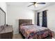 Bright bedroom with a ceiling fan, bed and adjacent dresser at 148 Emanuelle Dr, Winter Haven, FL 33884