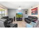 Living room features comfortable seating, a modern television, and a neutral color palette at 148 Emanuelle Dr, Winter Haven, FL 33884