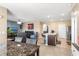 Open concept living space features a dining area and kitchen with tiled floors and neutral paint at 148 Emanuelle Dr, Winter Haven, FL 33884