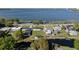 Aerial view showcasing lakefront homes with lush green lawns and easy water access at 1530 S Lake Howard Dr, Winter Haven, FL 33880