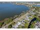 Beautiful aerial view of lakefront homes with mature trees and stunning lake views at 1530 S Lake Howard Dr, Winter Haven, FL 33880