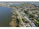 Panoramic aerial view showcases lakeside homes, docks, and tree-lined streets at 1530 S Lake Howard Dr, Winter Haven, FL 33880