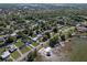 Aerial shot shows homes nestled between lakes, highlighting waterfront living and lush greenery at 1530 S Lake Howard Dr, Winter Haven, FL 33880