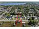 Aerial shot shows the properties that provide quick lake access from a residential area at 1530 S Lake Howard Dr, Winter Haven, FL 33880