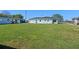 Spacious backyard with lush green grass, perfect for outdoor activities and relaxation at 1530 S Lake Howard Dr, Winter Haven, FL 33880
