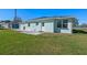 Charming backyard with well-maintained lawn and patio, perfect for outdoor entertaining and relaxation at 1530 S Lake Howard Dr, Winter Haven, FL 33880