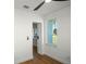 Bright bedroom with hardwood floors, ceiling fan, and window, perfect for relaxation and comfort at 1530 S Lake Howard Dr, Winter Haven, FL 33880