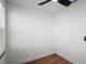 Bright bedroom with hardwood floors, a ceiling fan, and neutral walls that provide versatile design options at 1530 S Lake Howard Dr, Winter Haven, FL 33880