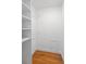 Spacious closet with built-in shelving and hardwood floors at 1530 S Lake Howard Dr, Winter Haven, FL 33880