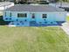 Well-maintained single-Gathering home with a lush lawn, white rock landscaping, and attached garage at 1530 S Lake Howard Dr, Winter Haven, FL 33880