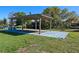 Covered outdoor pavilion with wooden support beams and concrete base, ideal for entertaining at 1530 S Lake Howard Dr, Winter Haven, FL 33880
