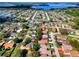 Beautiful aerial view of a quiet neighborhood with lake views in the distance at 1822 Nicaragua Way, Winter Haven, FL 33881