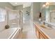Bathroom featuring a tub shower combo, vanity, and tile flooring at 1822 Nicaragua Way, Winter Haven, FL 33881