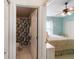 En-suite bedroom featuring a spacious design with a ceiling fan and natural light at 1822 Nicaragua Way, Winter Haven, FL 33881