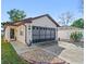 Charming single Gathering home featuring a well-maintained lawn and driveway at 1822 Nicaragua Way, Winter Haven, FL 33881