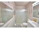 The bathroom includes a glass shower, a toilet, and a sink with vanity for convenience at 200 El Camino Dr # 206, Winter Haven, FL 33884