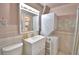This cozy bathroom features a stackable washer and dryer combo for added convenience and a streamlined design at 200 El Camino Dr # 206, Winter Haven, FL 33884