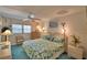 Comfortable bedroom with ample natural light, ceiling fan, and calming decor at 200 El Camino Dr # 206, Winter Haven, FL 33884