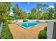 Enjoy a serene and refreshing experience in this community pool surrounded by lush greenery and offering a tranquil escape at 200 El Camino Dr # 206, Winter Haven, FL 33884